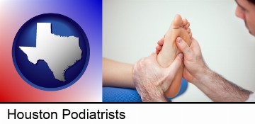 a podiatrist practicing reflexology on a human foot in Houston, TX