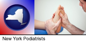 New York, New York - a podiatrist practicing reflexology on a human foot