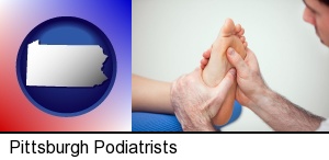 a podiatrist practicing reflexology on a human foot in Pittsburgh, PA