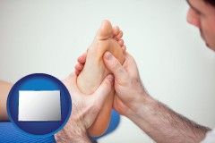 colorado map icon and a podiatrist practicing reflexology on a human foot