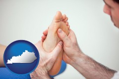 kentucky map icon and a podiatrist practicing reflexology on a human foot