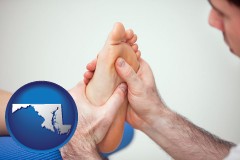 maryland map icon and a podiatrist practicing reflexology on a human foot