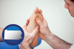 pennsylvania map icon and a podiatrist practicing reflexology on a human foot